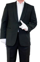 ein Mann deutet mit dem im weissen Handschuh steckendem Zeigefinger nach Oben um die Geste einer Aufforderung nachzuahmen 