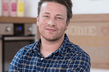 Jamie Oliver lächelnd in Wien karriertes Hemd